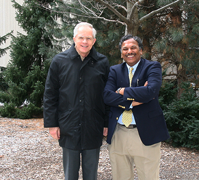 Profs Dravid and Howe, outside Cook Hall